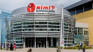 Facade of Rimi Olympic center on a sunny day